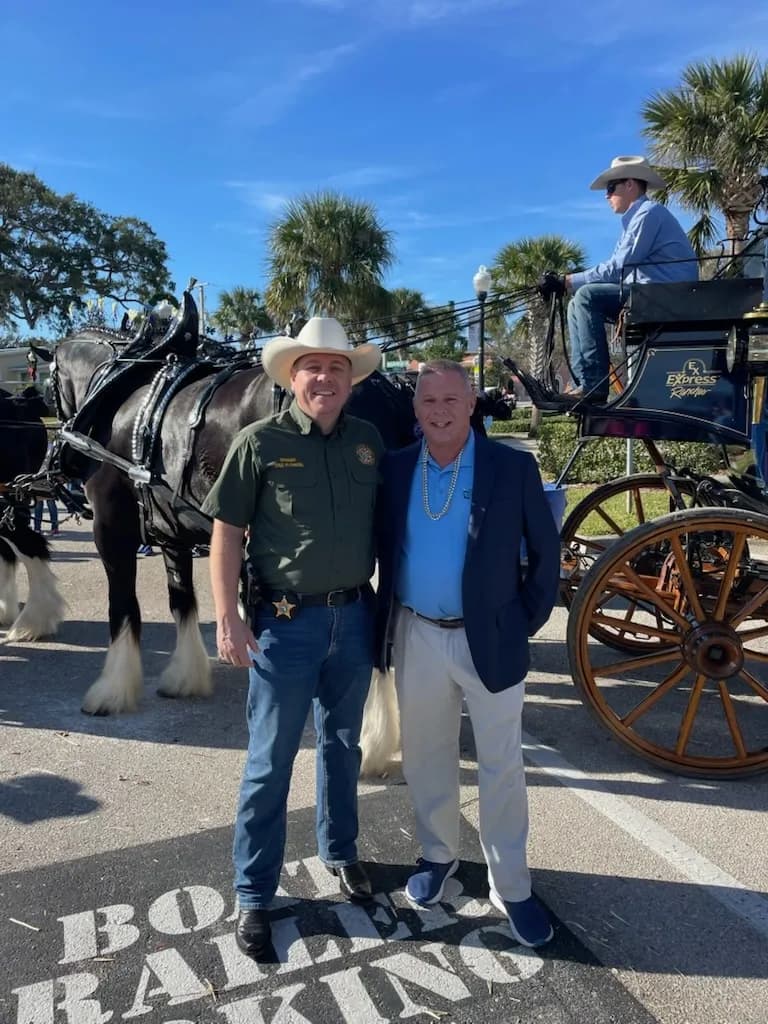 Bob McPartlan with the sheriff at a community parade
