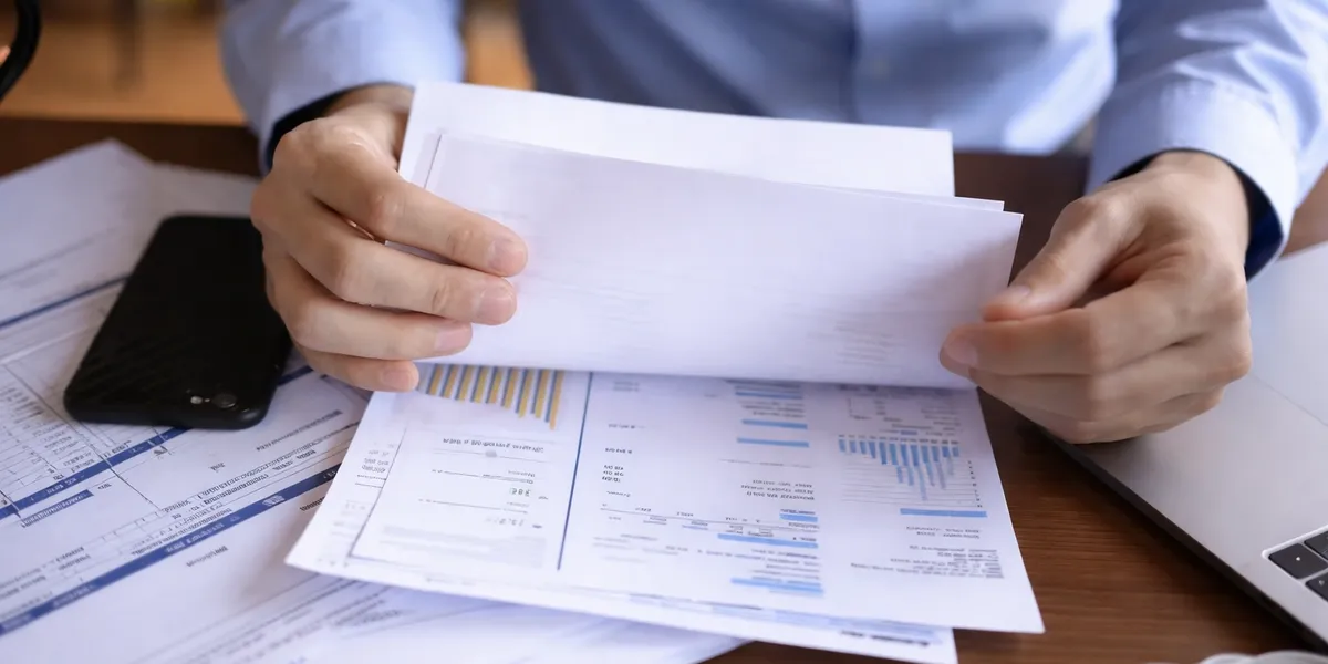 Calculator and budget documents representing disciplined budgeting